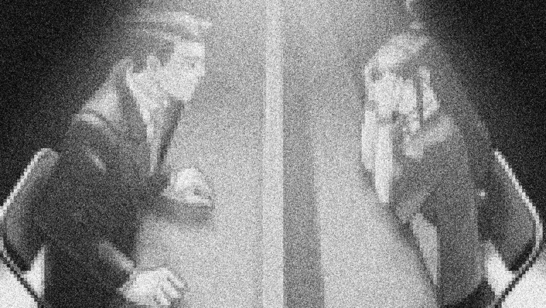 Grainy CCTV image showing Phoenix Wright and Maya Fey's Detention Center meeting